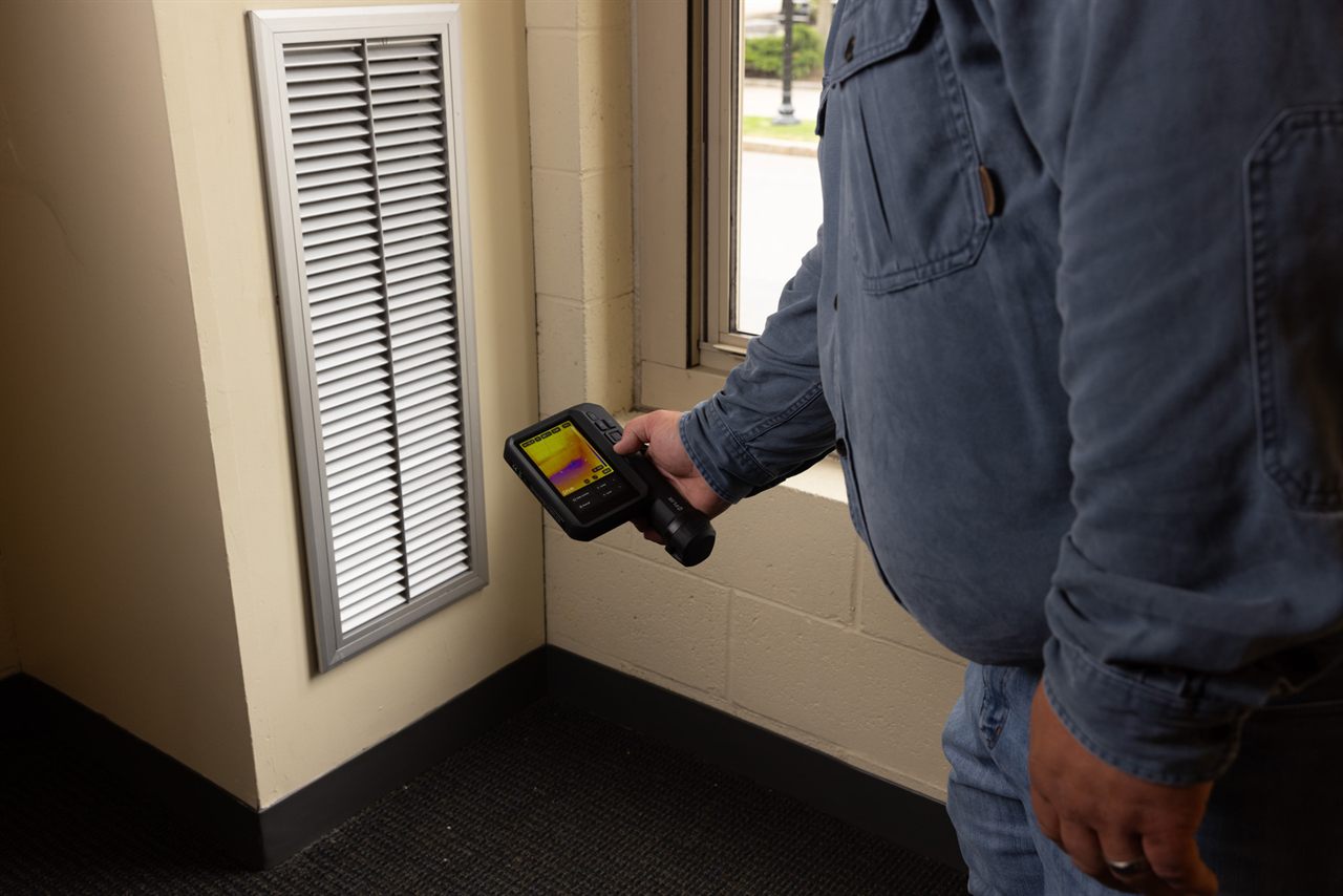 Building insulation and envelope thermal scan captured with a FLIR camera.