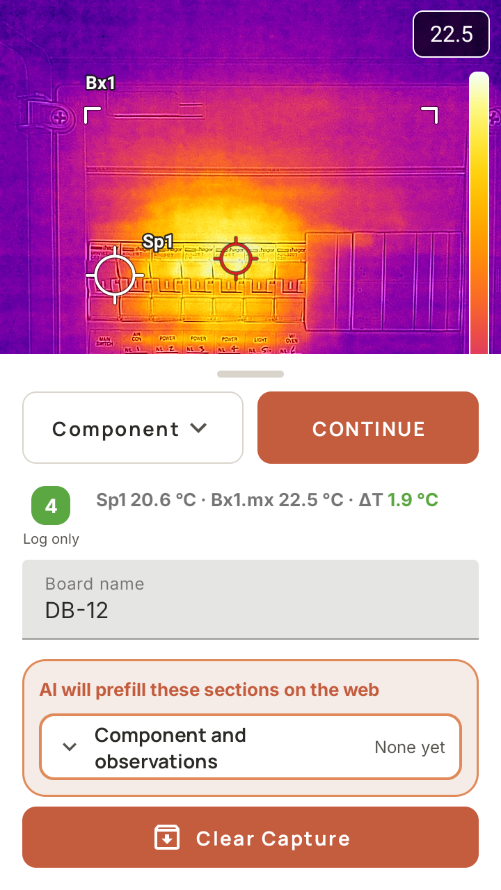 SwitchReport on the FLIR i34 capture screen: a thermal image of a switchboard with a box and two spot markers, and under it a green priority 4 chip reading Log only beside Sp1 20.6 degrees, Bx1 max 22.5 degrees and a delta T of 1.9 degrees, with the board named DB-12.